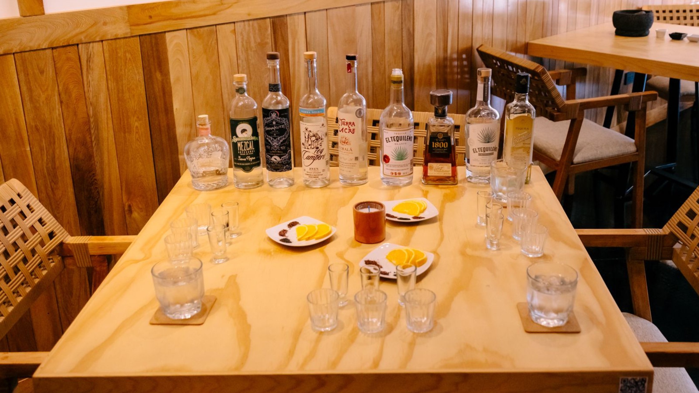 Mezcal tasting flight at Agavia Bar rooftop terrace with sunset views of San José del Cabo